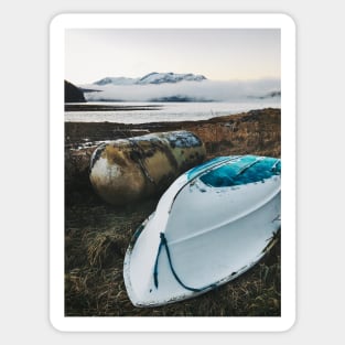 Old Gas Tank and White Boat Lying in Brown Grass on Cold Foggy Winter Day Sticker